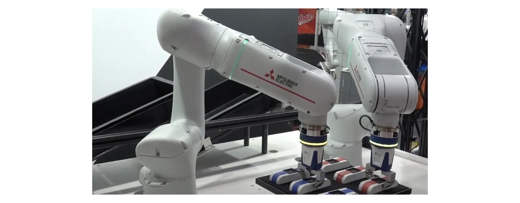 A collection of white machines arranged in a workspace.