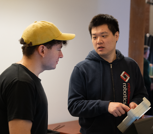 two team members talking