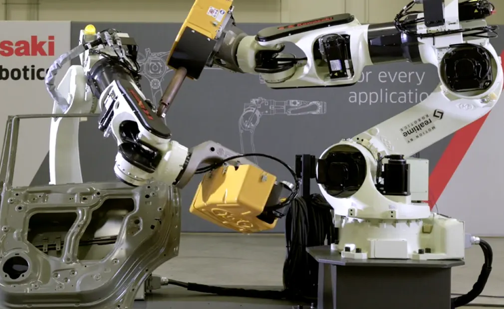 Automated robotic arms handling automotive components